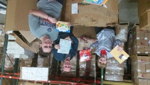 Students sorting books by subject and age level at Books for Africa