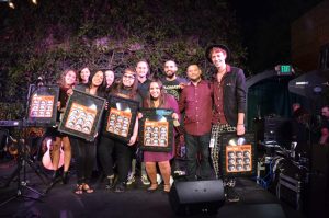 The top 5 college representatives with their plaques in Los Angeles